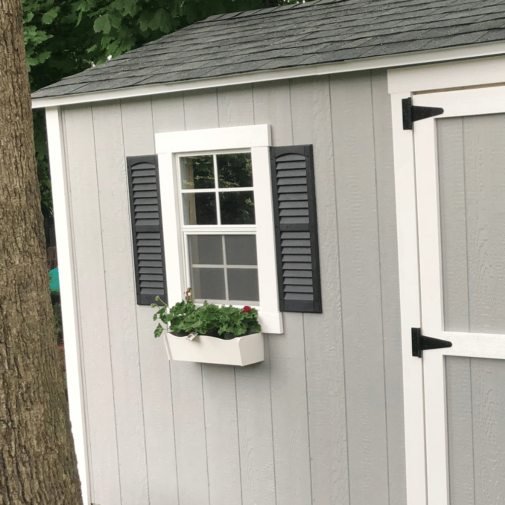 A shed with a flower box